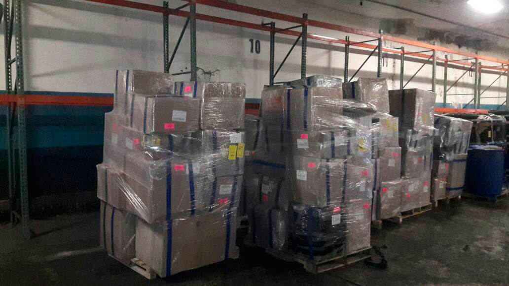 Shrink-wrapped pallets staged in the PROPI USA warehouse racking